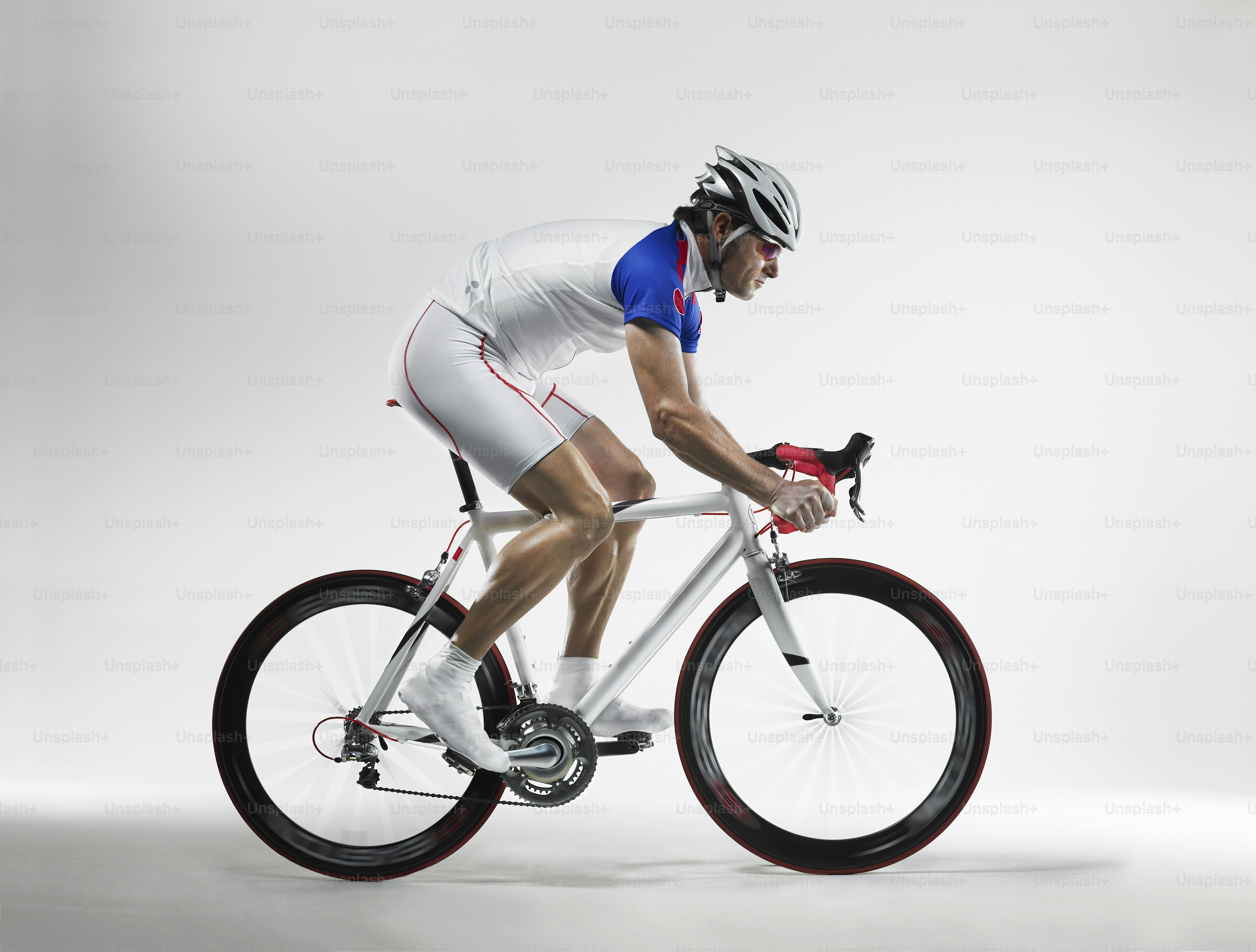 a man riding a bike while wearing a helmet
