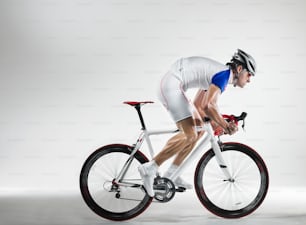 a man riding a bike while wearing a helmet