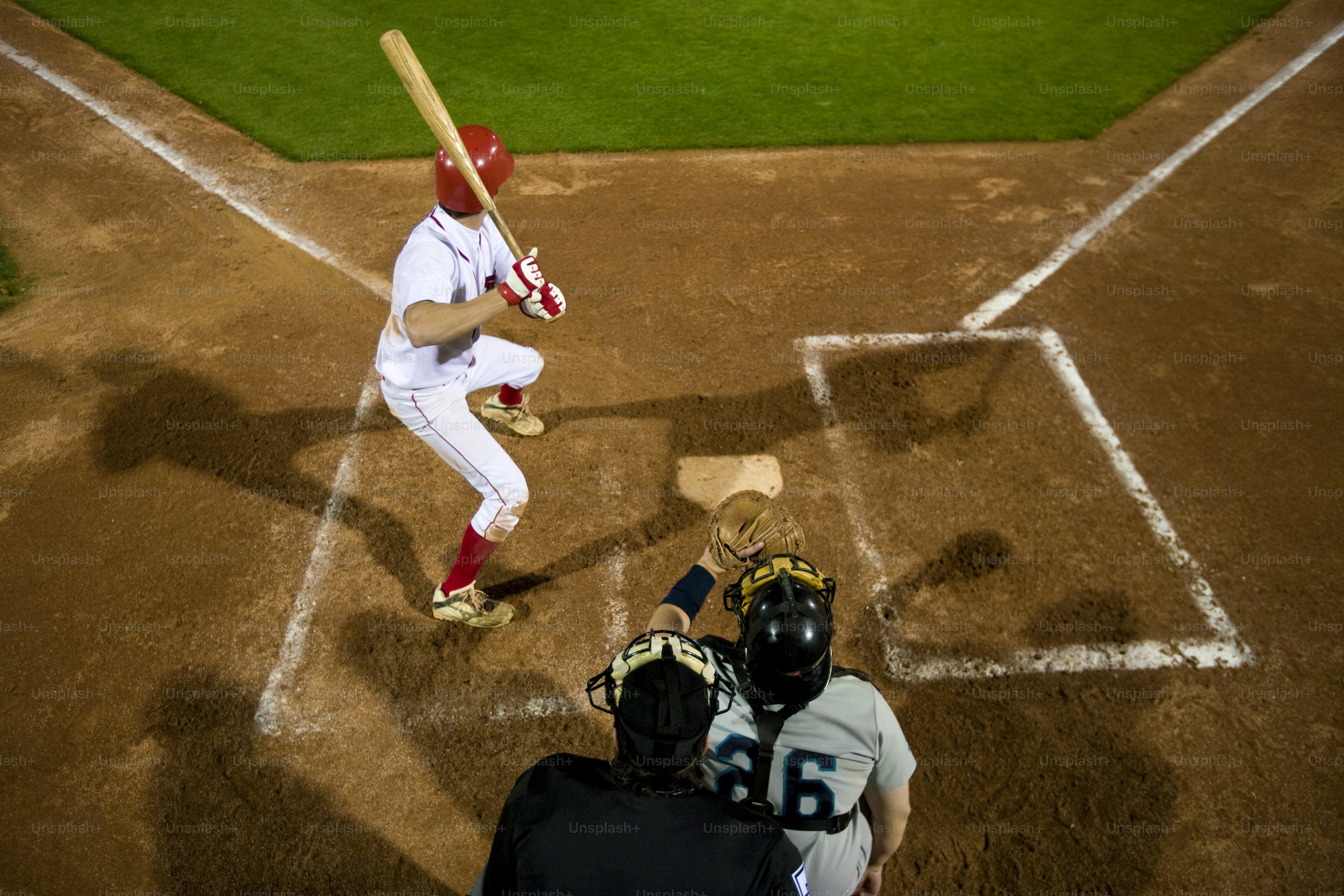 a batter, catcher and umpire during a baseball game