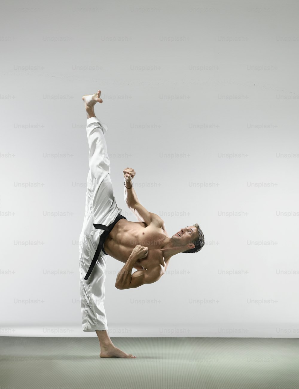 a man is doing a handstand on the floor