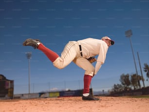 a baseball player in a red and white uniform