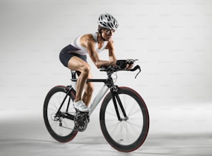 a man riding a bike while wearing a helmet