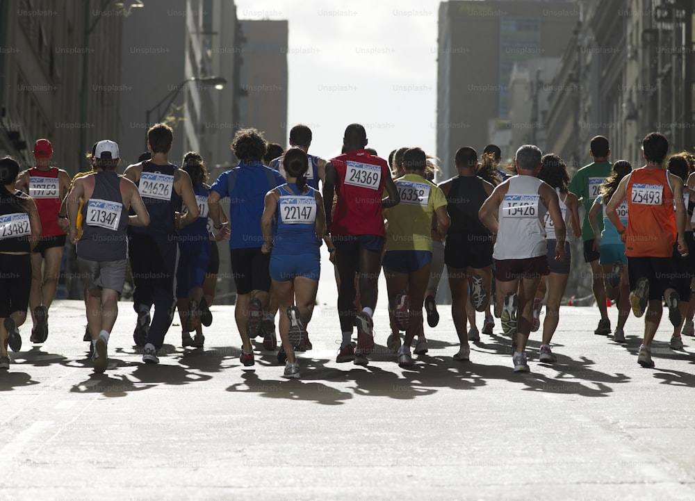 a group of people running in a marathon