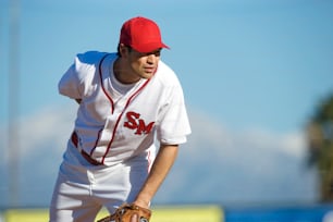 a baseball player in a red and white uniform