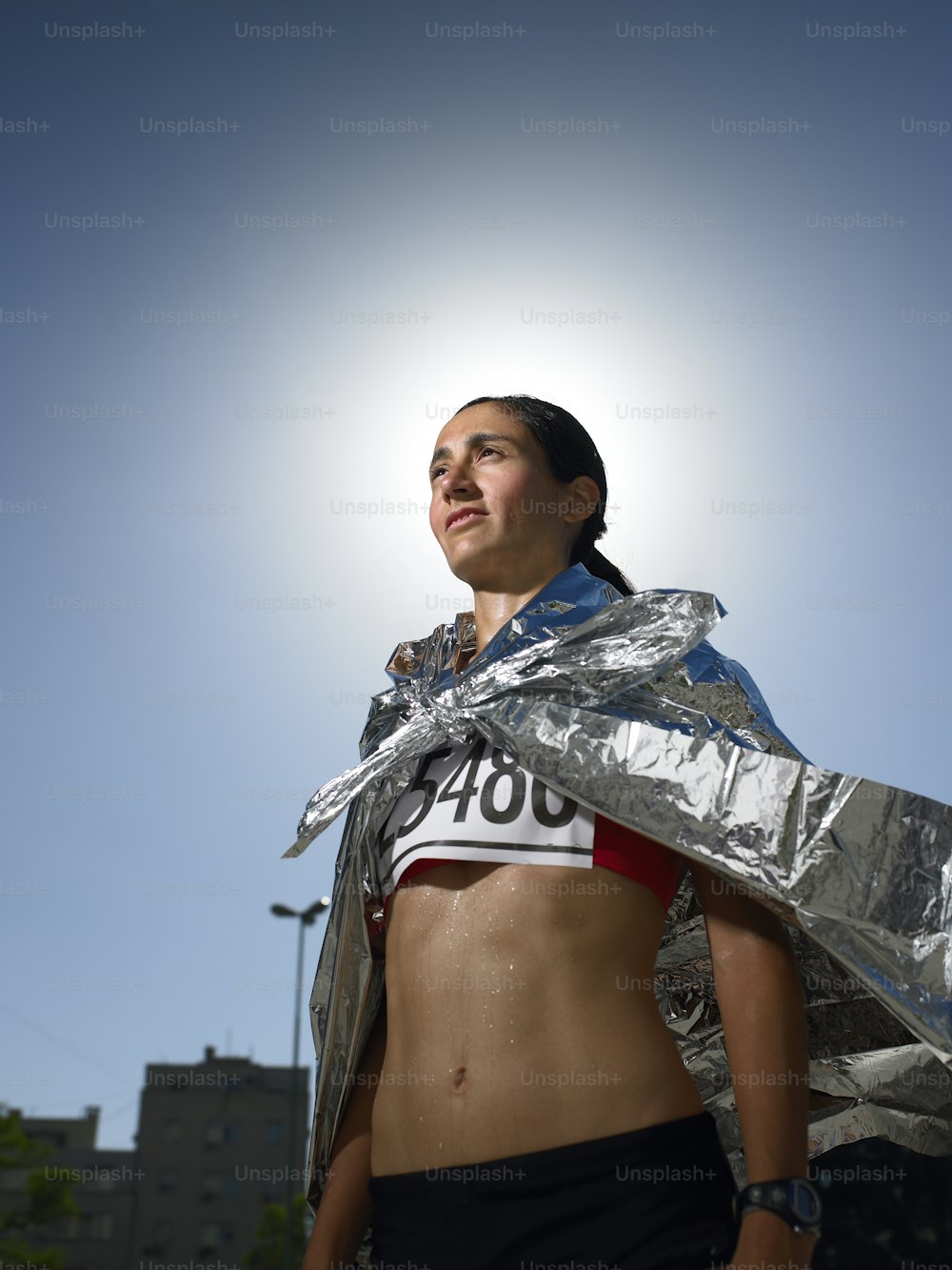 a woman in a silver wrap around her body