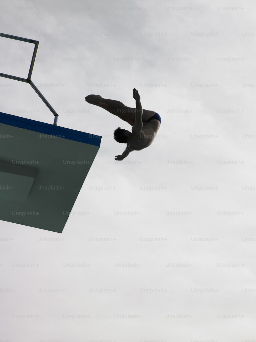 a man flying through the air while riding a skateboard