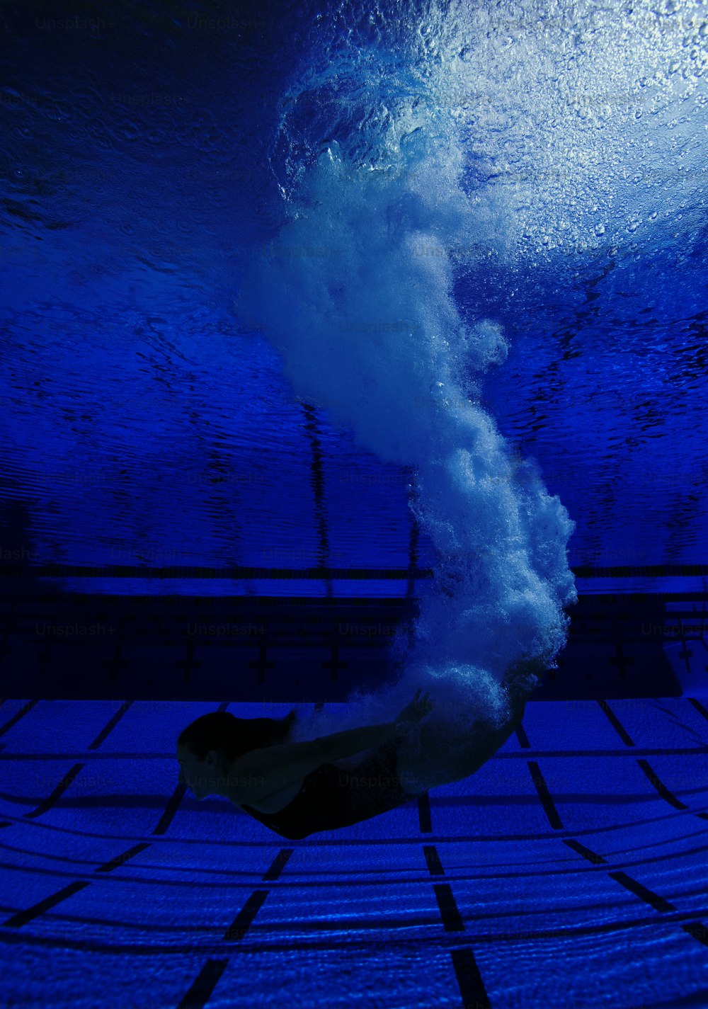 Underwater view of diver entering water