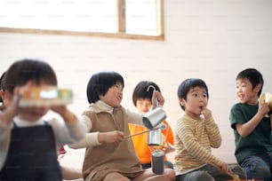 a group of young children sitting on the floor