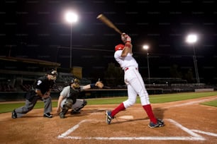 a baseball player swinging a bat on a field