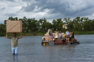 a group of people on a boat in the water