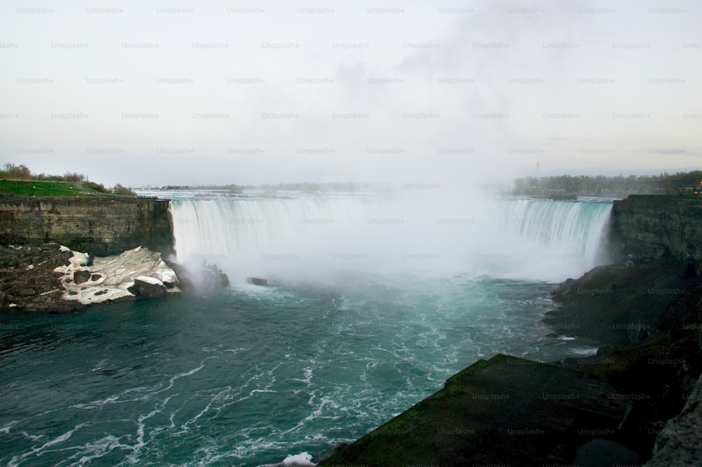 a large waterfall with water pouring out of it