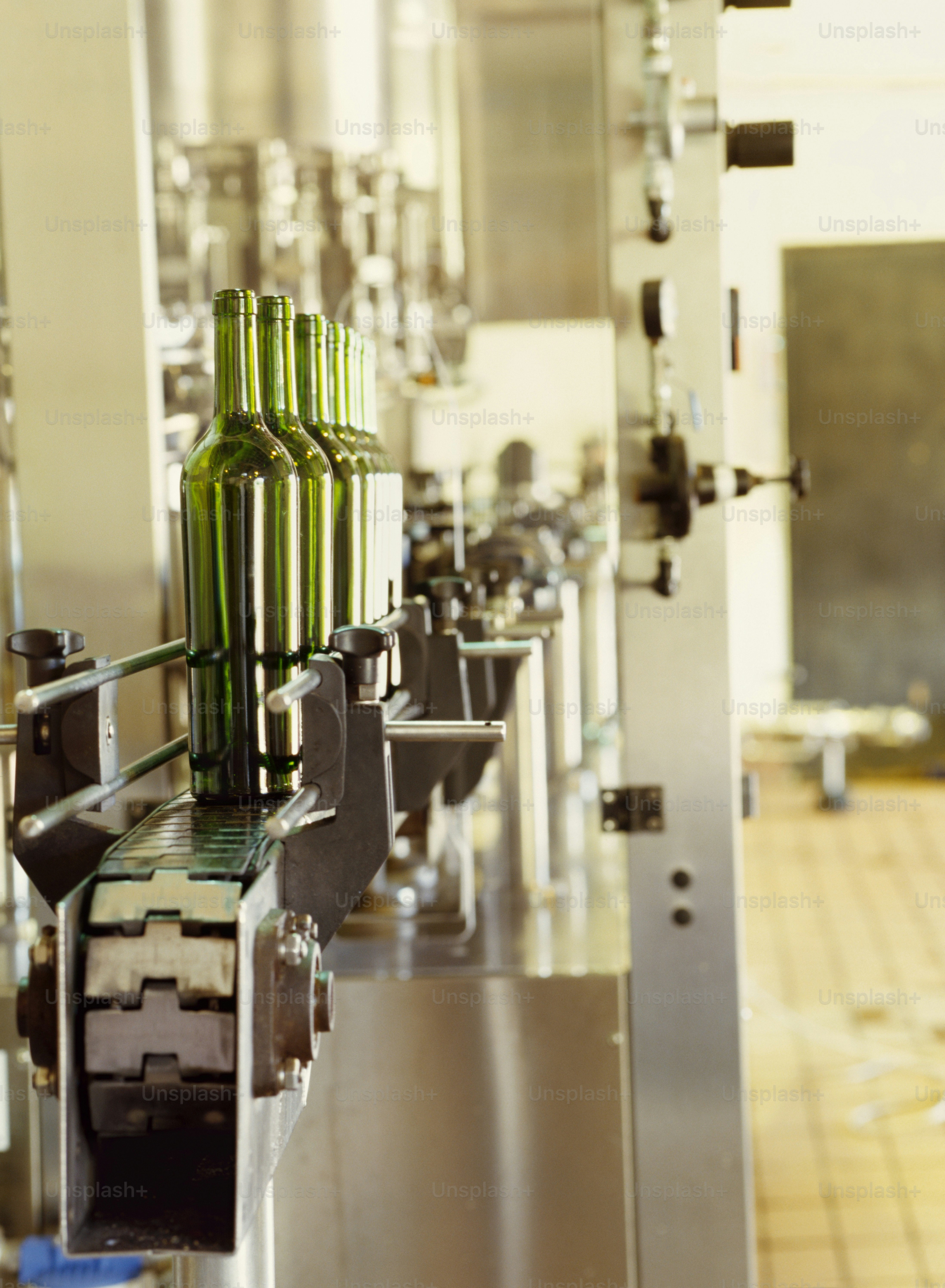 a line of bottles on a conveyor belt