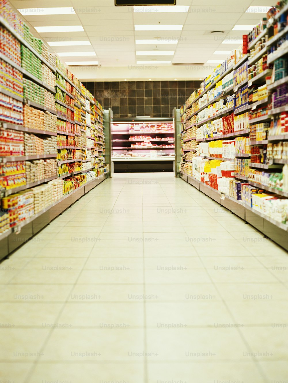 a grocery store aisle filled with lots of food