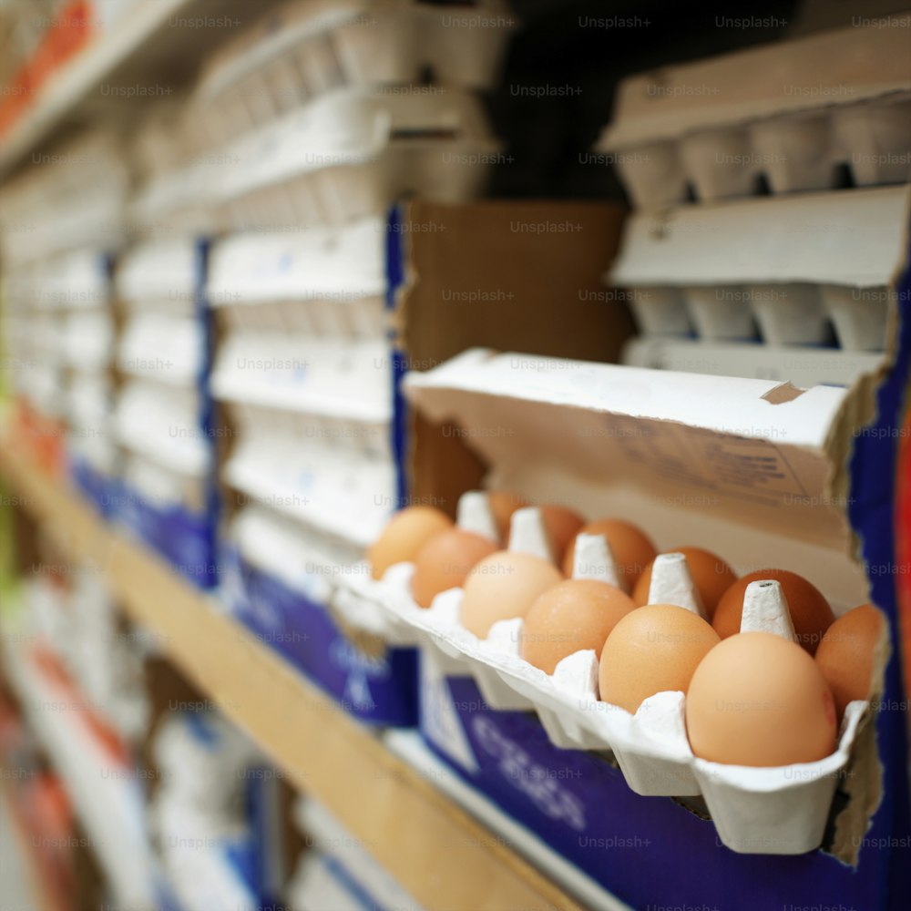 a bunch of eggs in a carton on a shelf