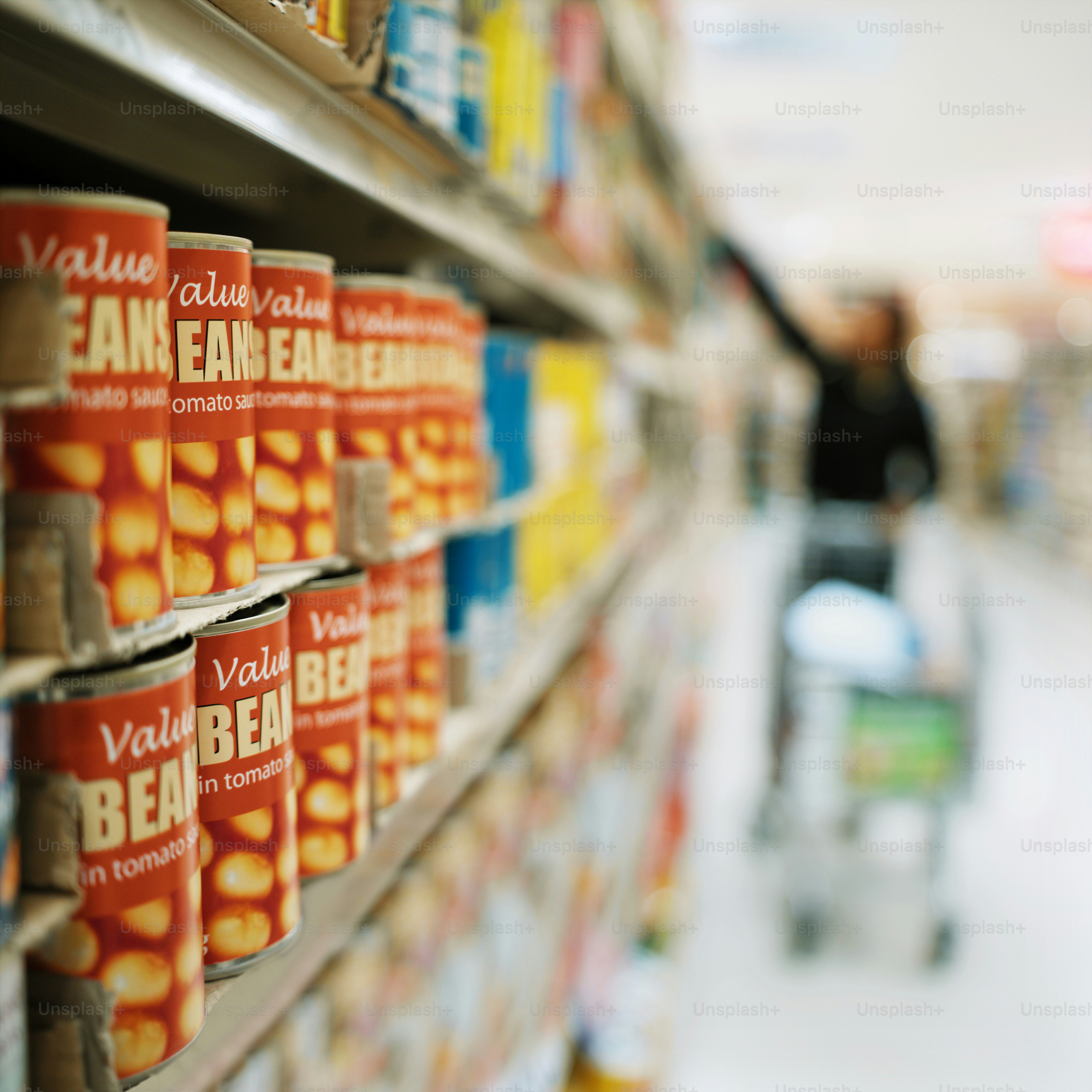 a row of canned beans in a grocery store