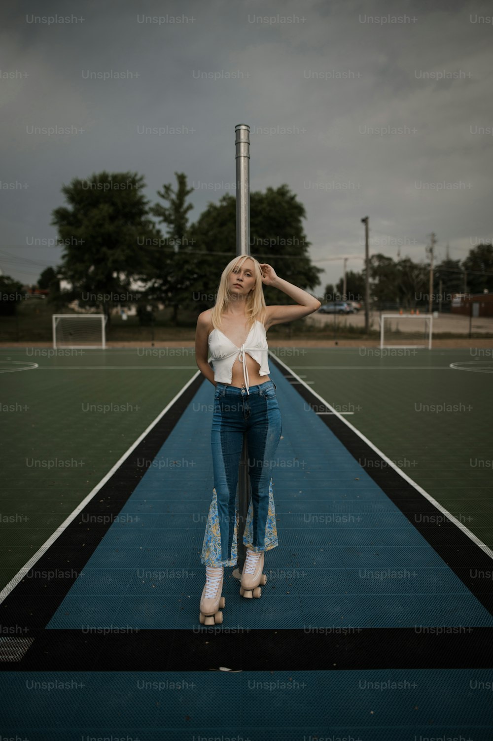 a woman is standing on a tennis court