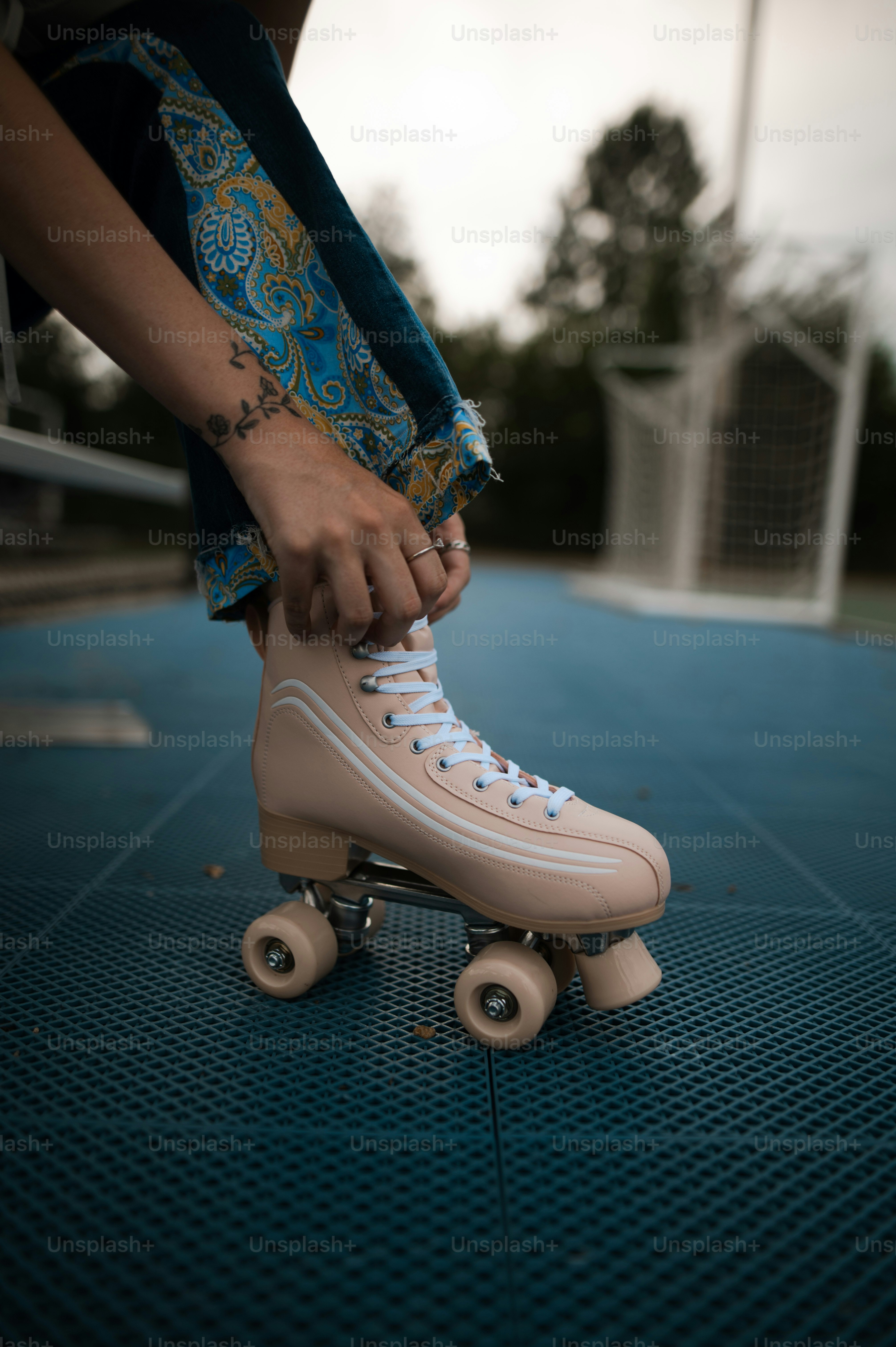 a person riding a skateboard on a blue surface