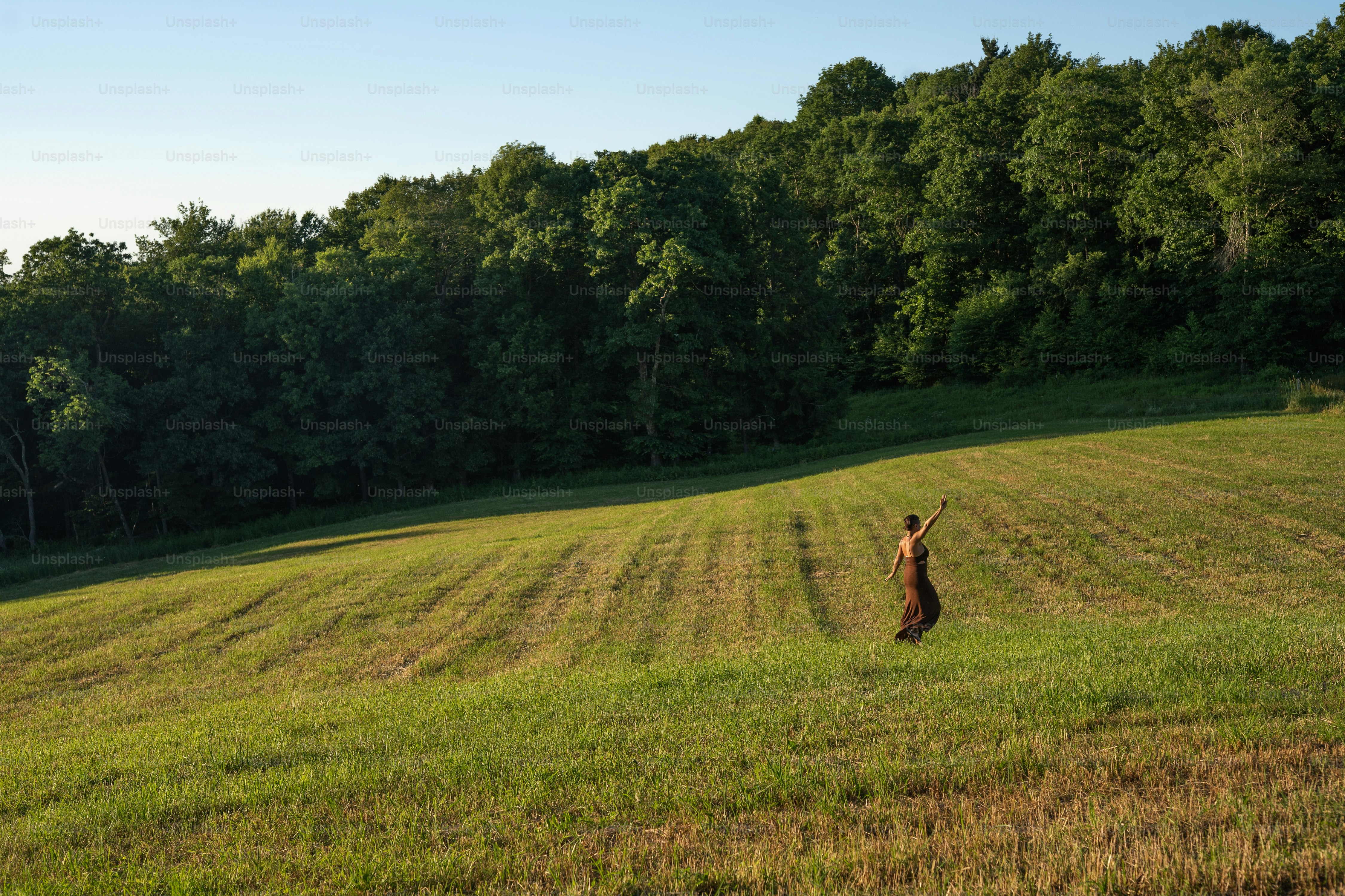 a person standing in the middle of a field
