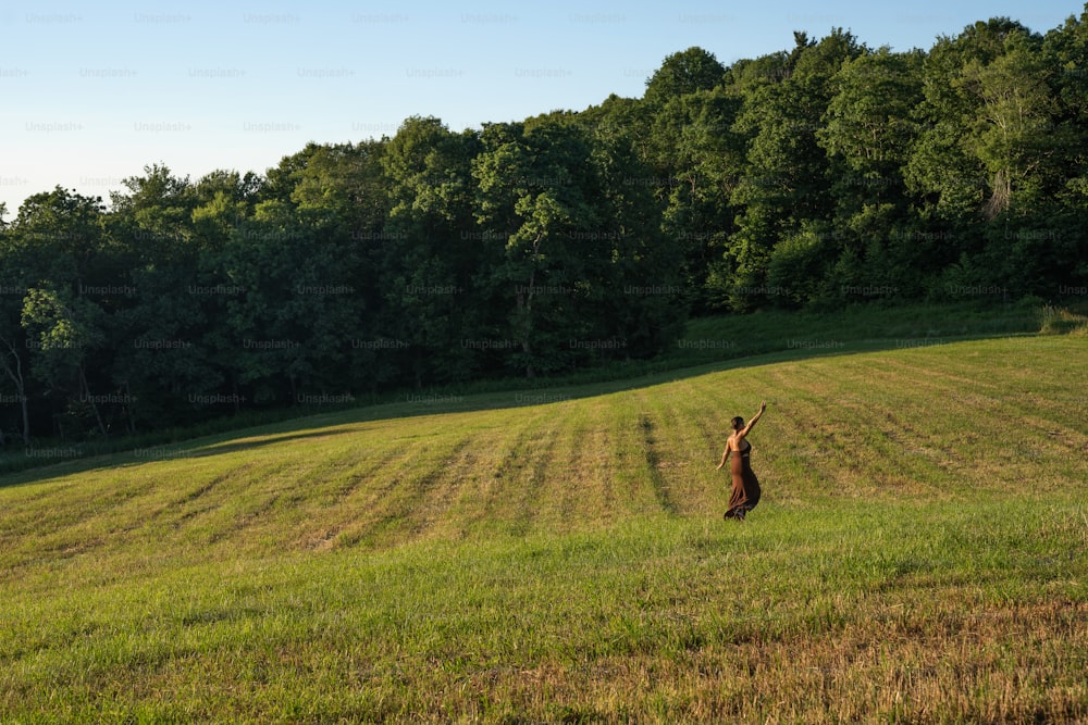 a person standing in the middle of a field