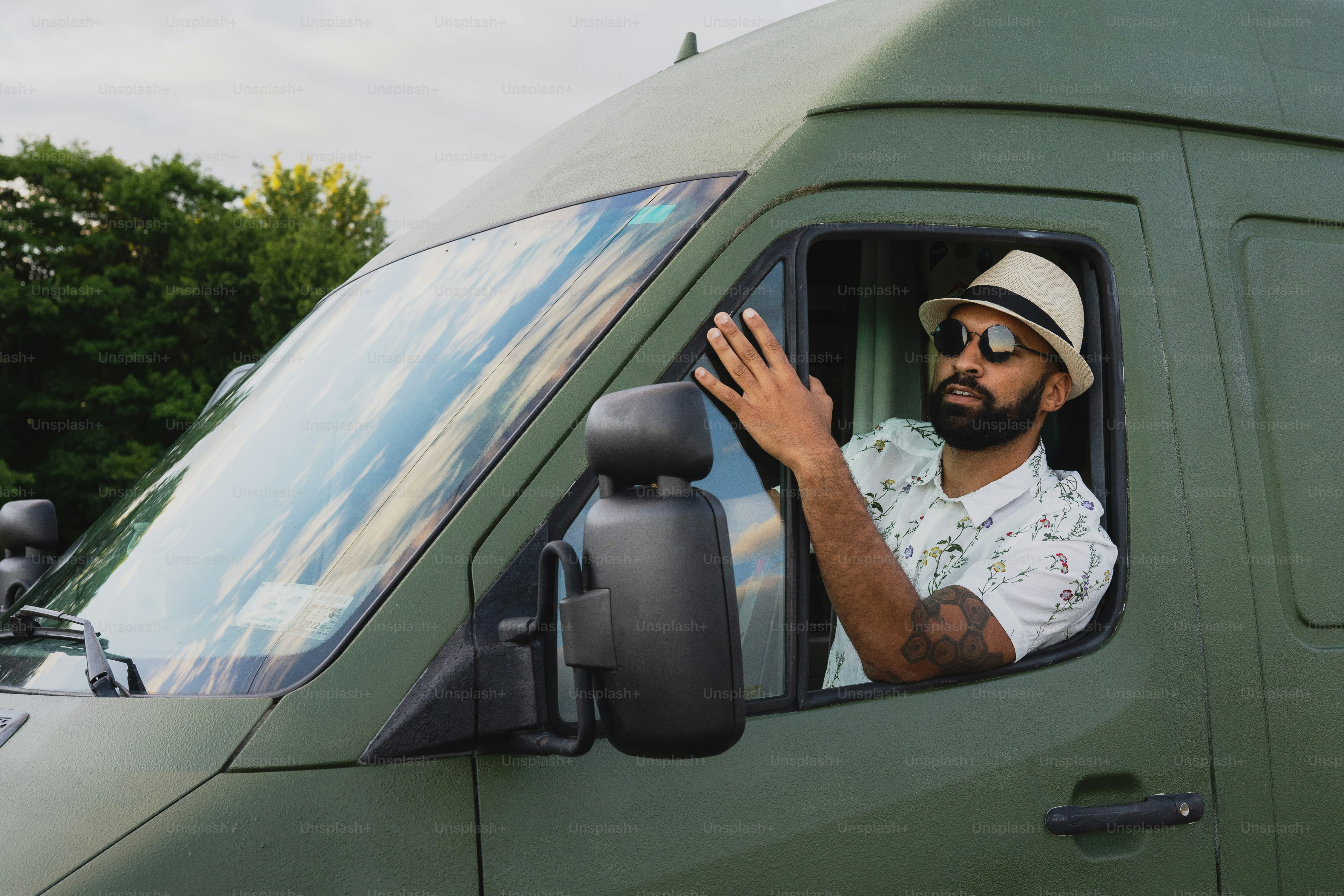 A man with a hat and sunglasses in a truck photo Man Image on Unsplash