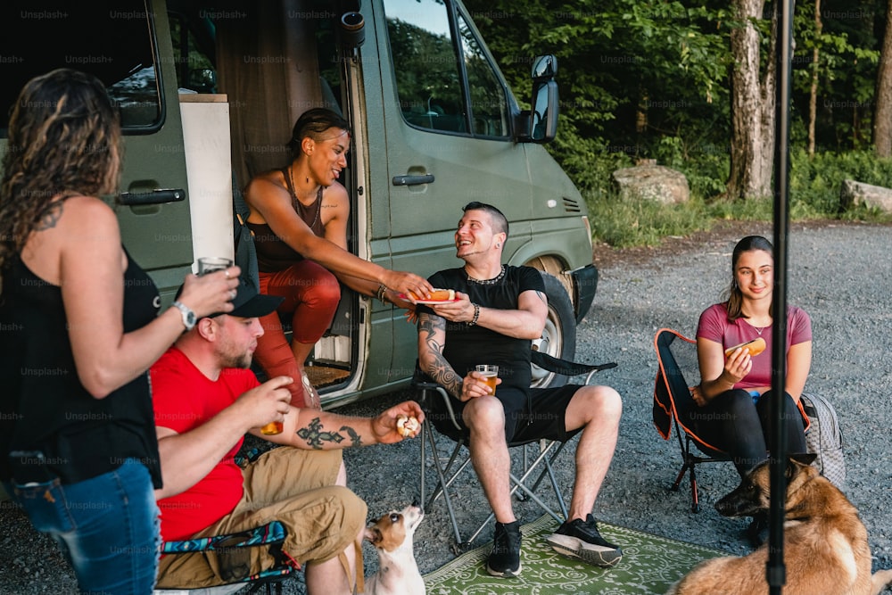 a group of people sitting around eating food