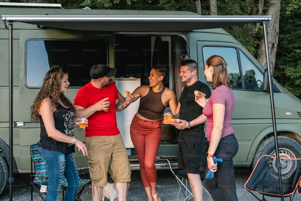 a group of people standing in front of a van