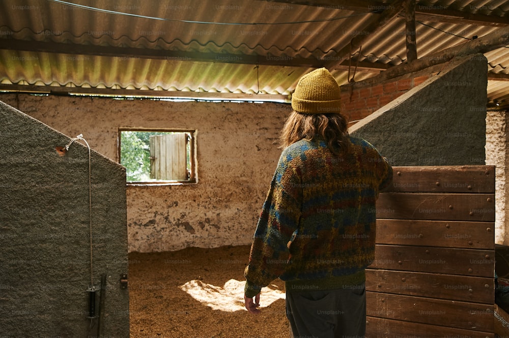 a person standing in a room with a window