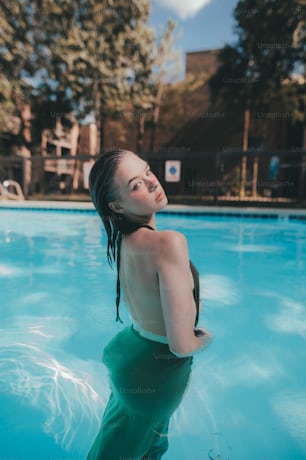 a woman standing in a pool of water