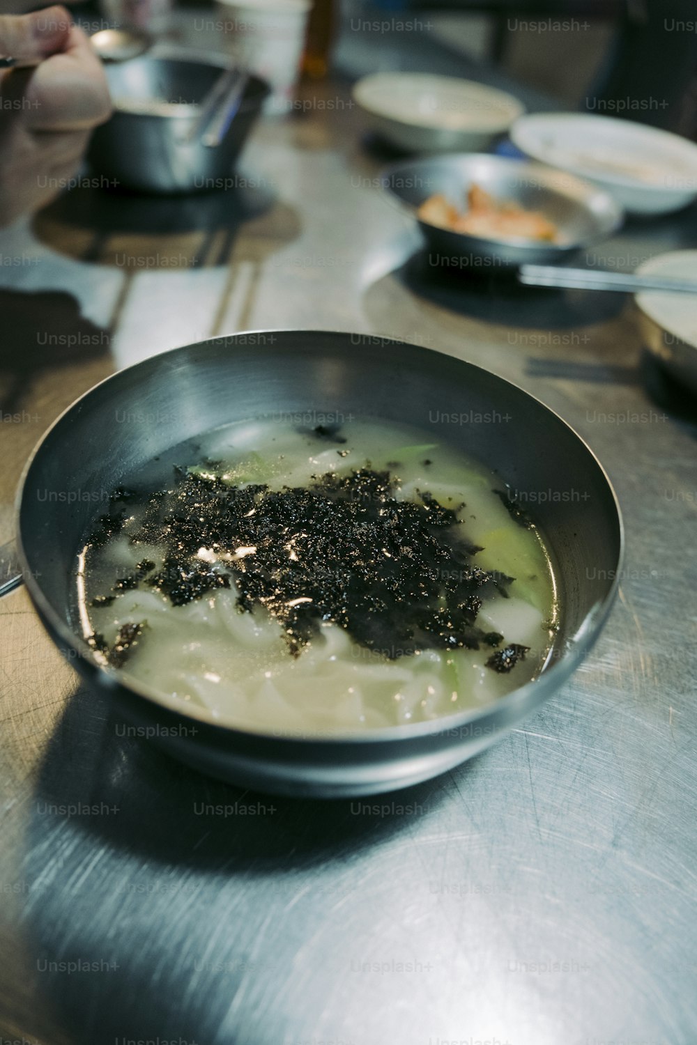 a bowl of food is sitting on a table