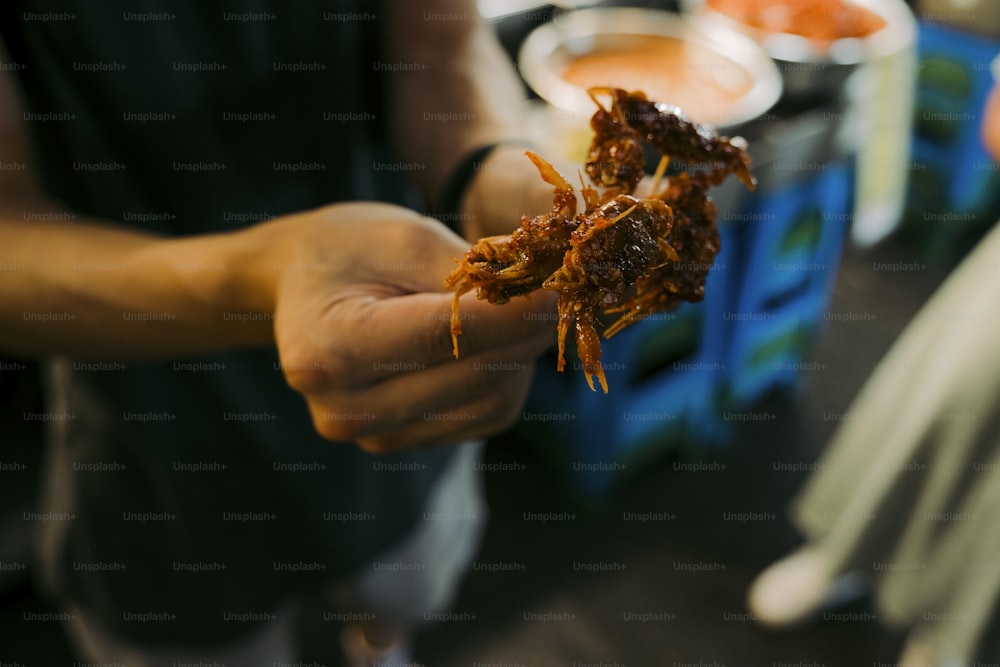 a person holding a piece of food in their hand