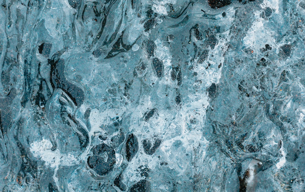 a close up of a blue and black marble