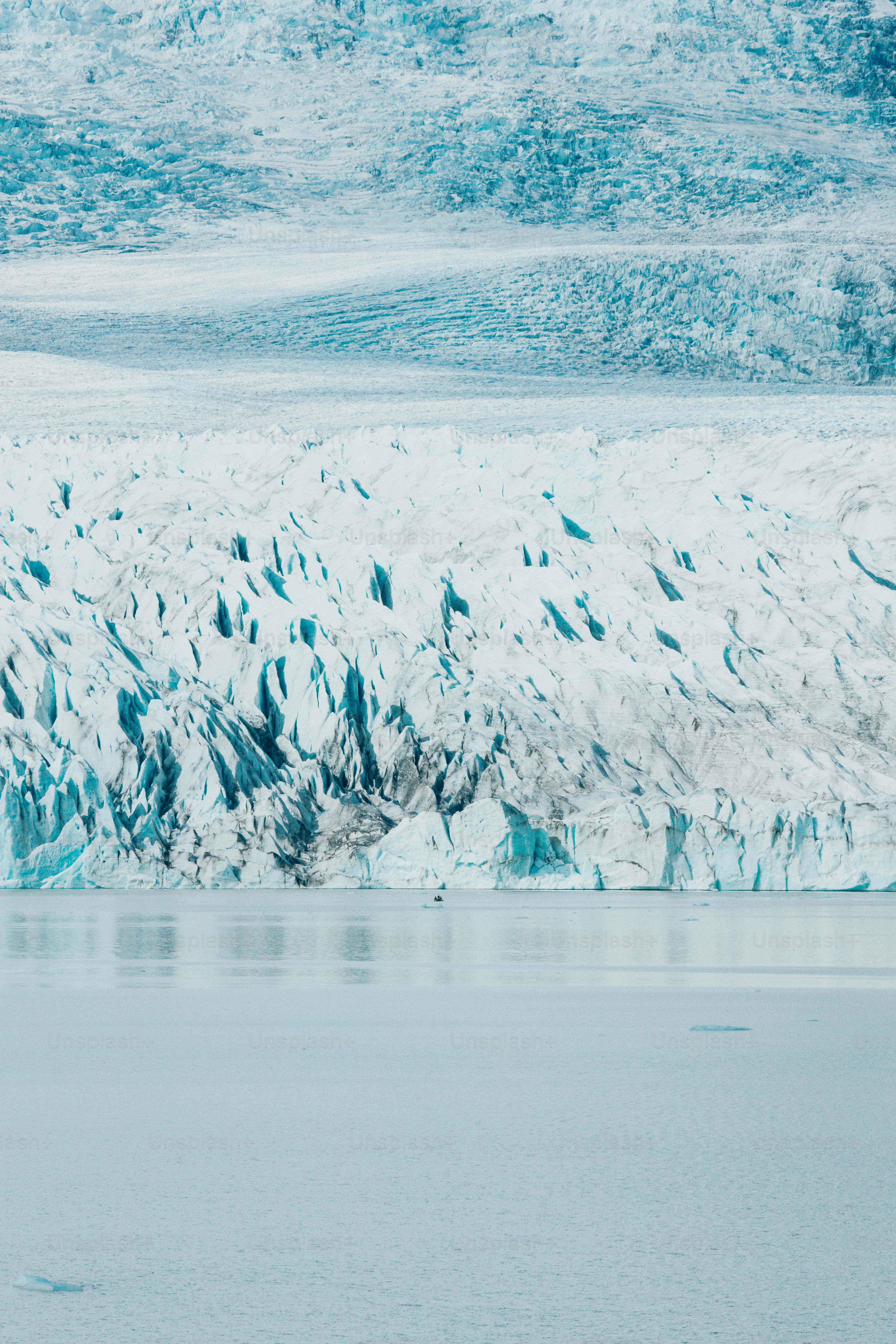 a man riding a surfboard on top of a body of water