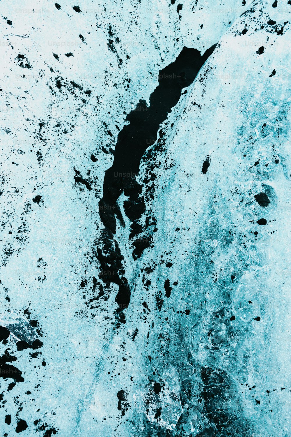 a black and white photo of water and ice