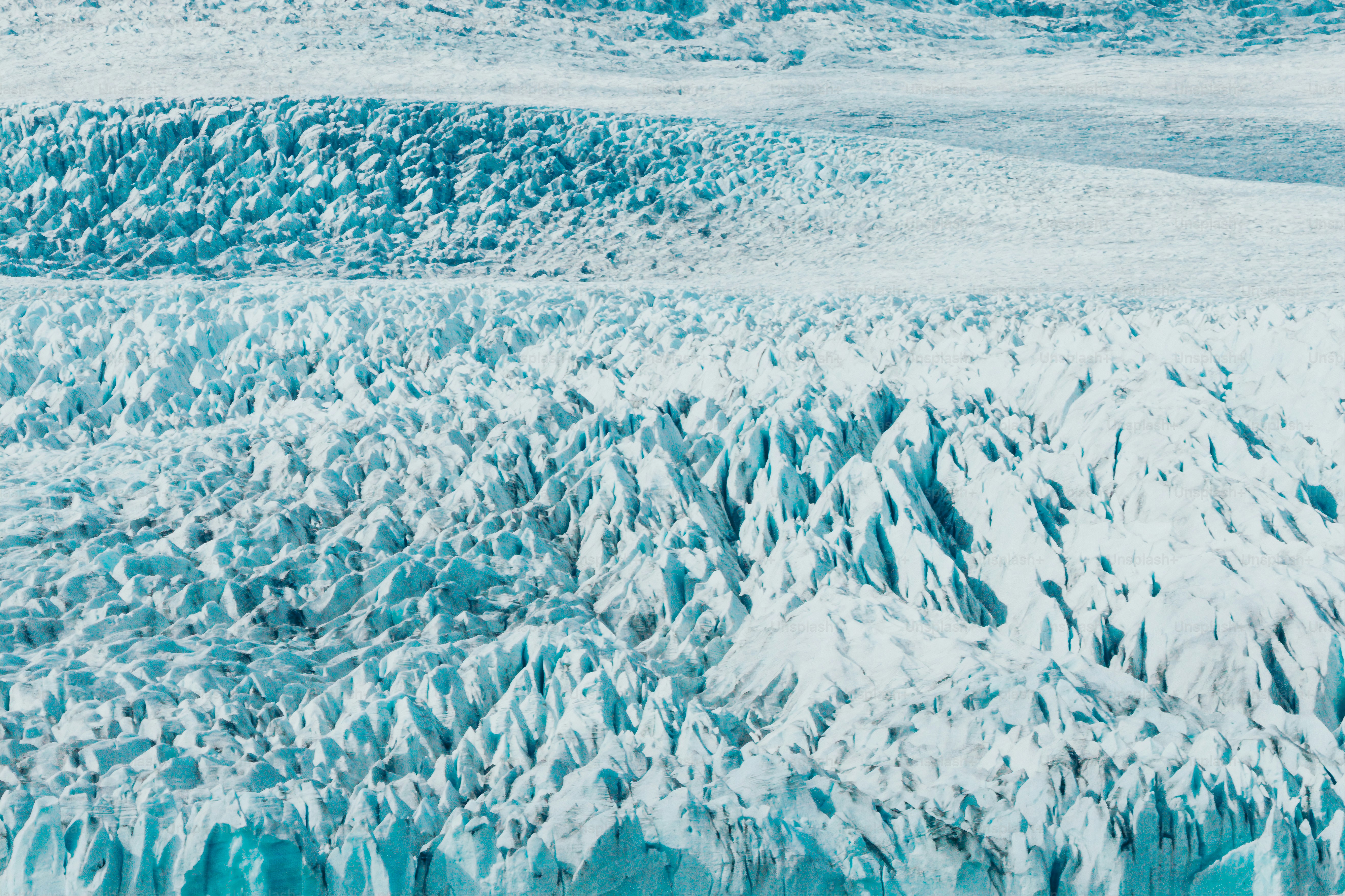 a large glacier with lots of snow on it