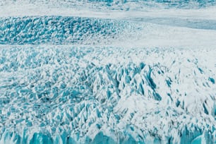 a large glacier with lots of snow on it