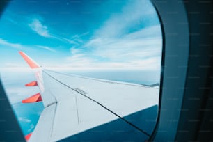 a view of the wing of an airplane in the sky