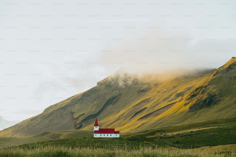 a small church in the middle of a mountain range