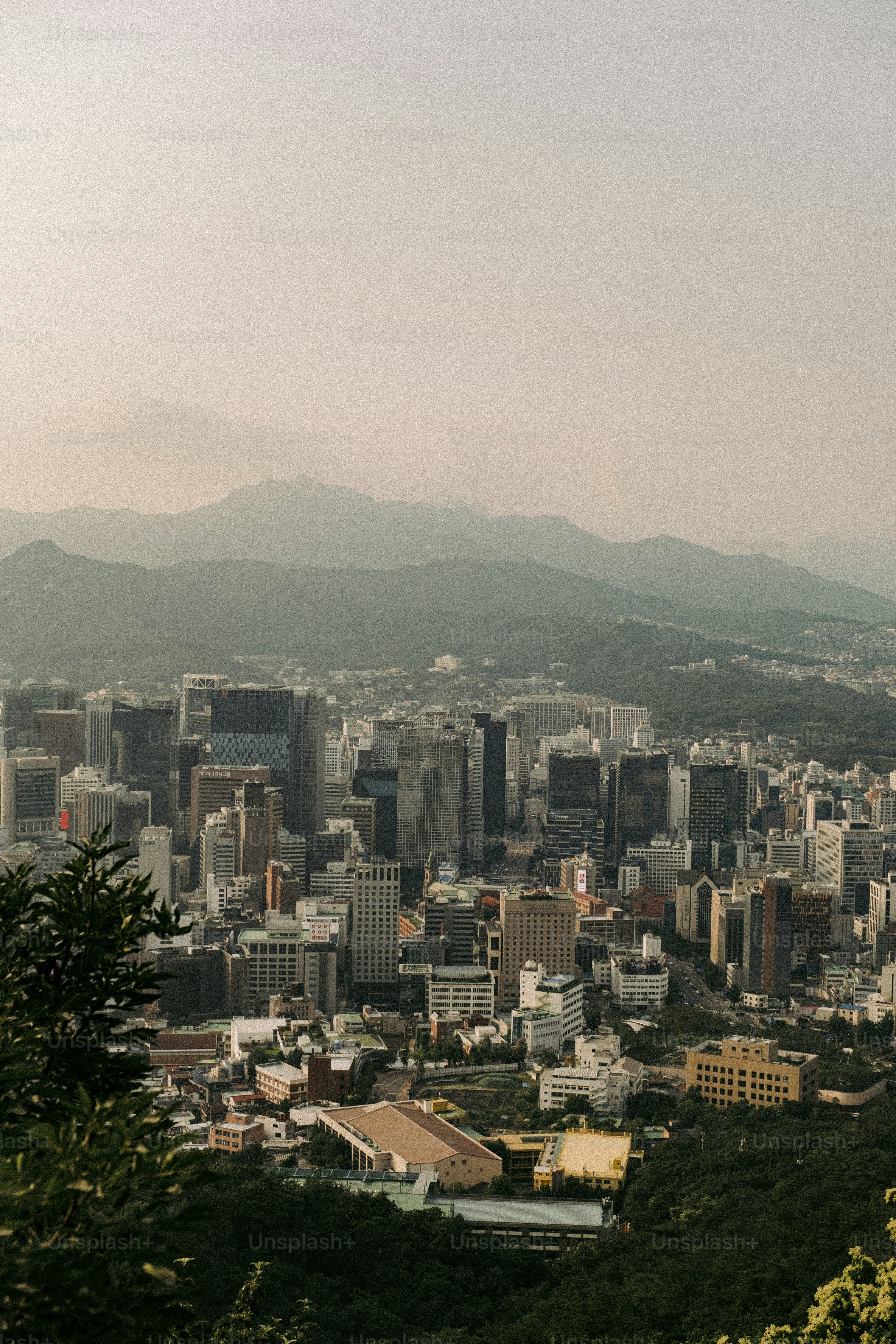 a view of a city with mountains in the background