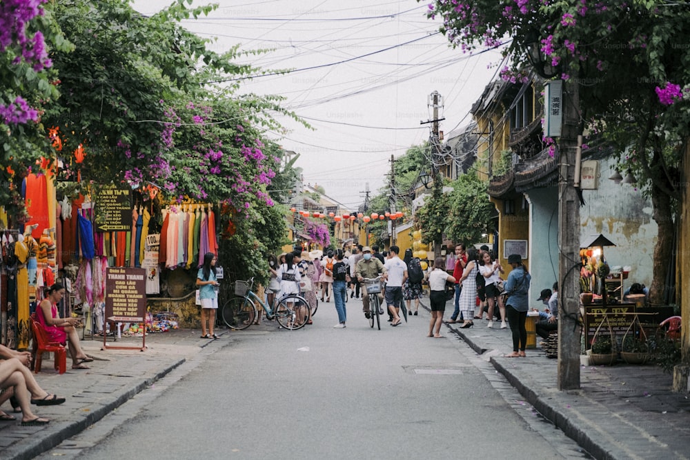 a group of people walking down a street