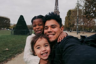 a man taking a selfie with two little girls