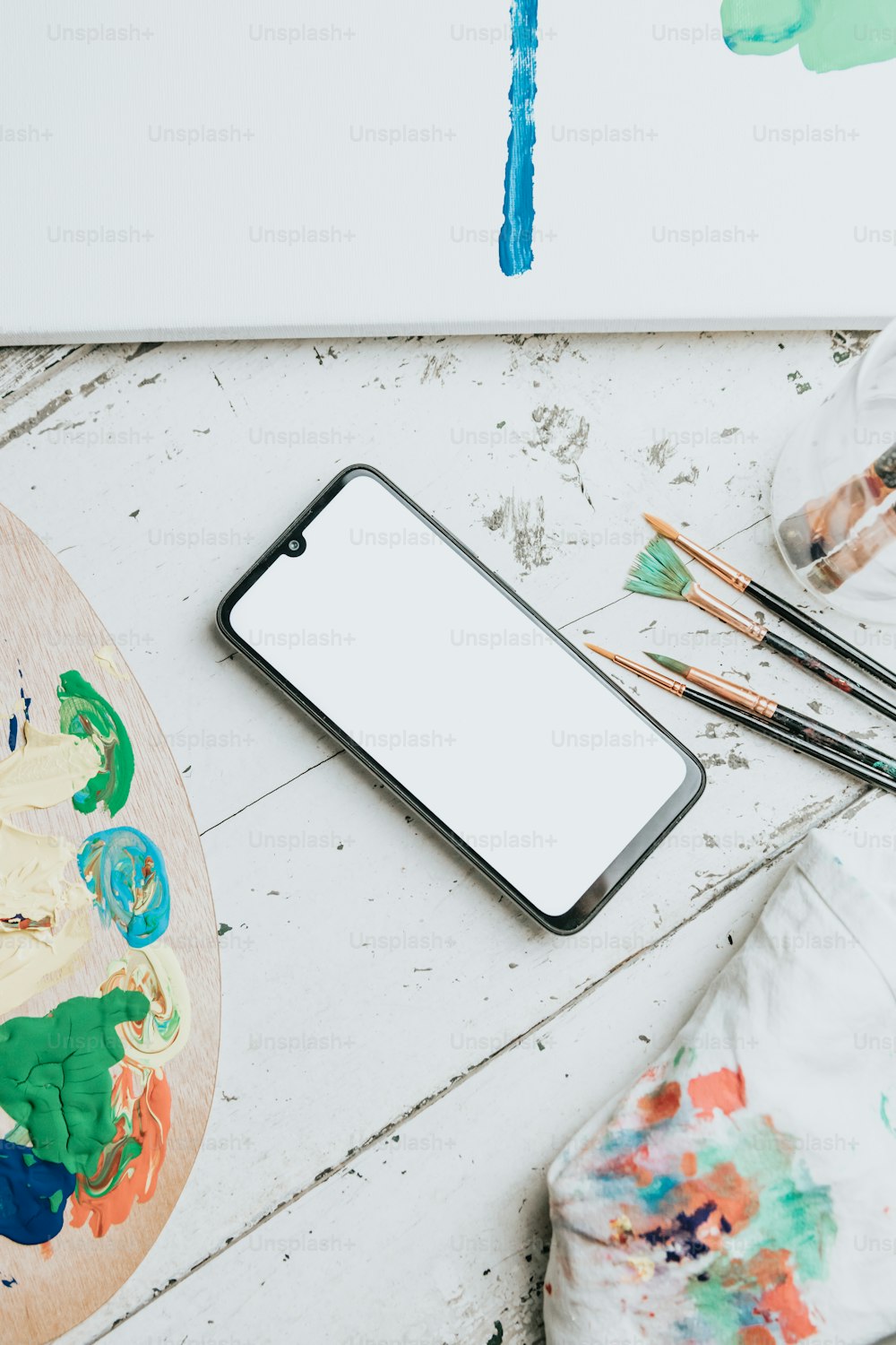 a cell phone sitting on top of a wooden table