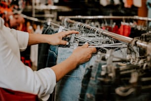 a person working on a pair of jeans