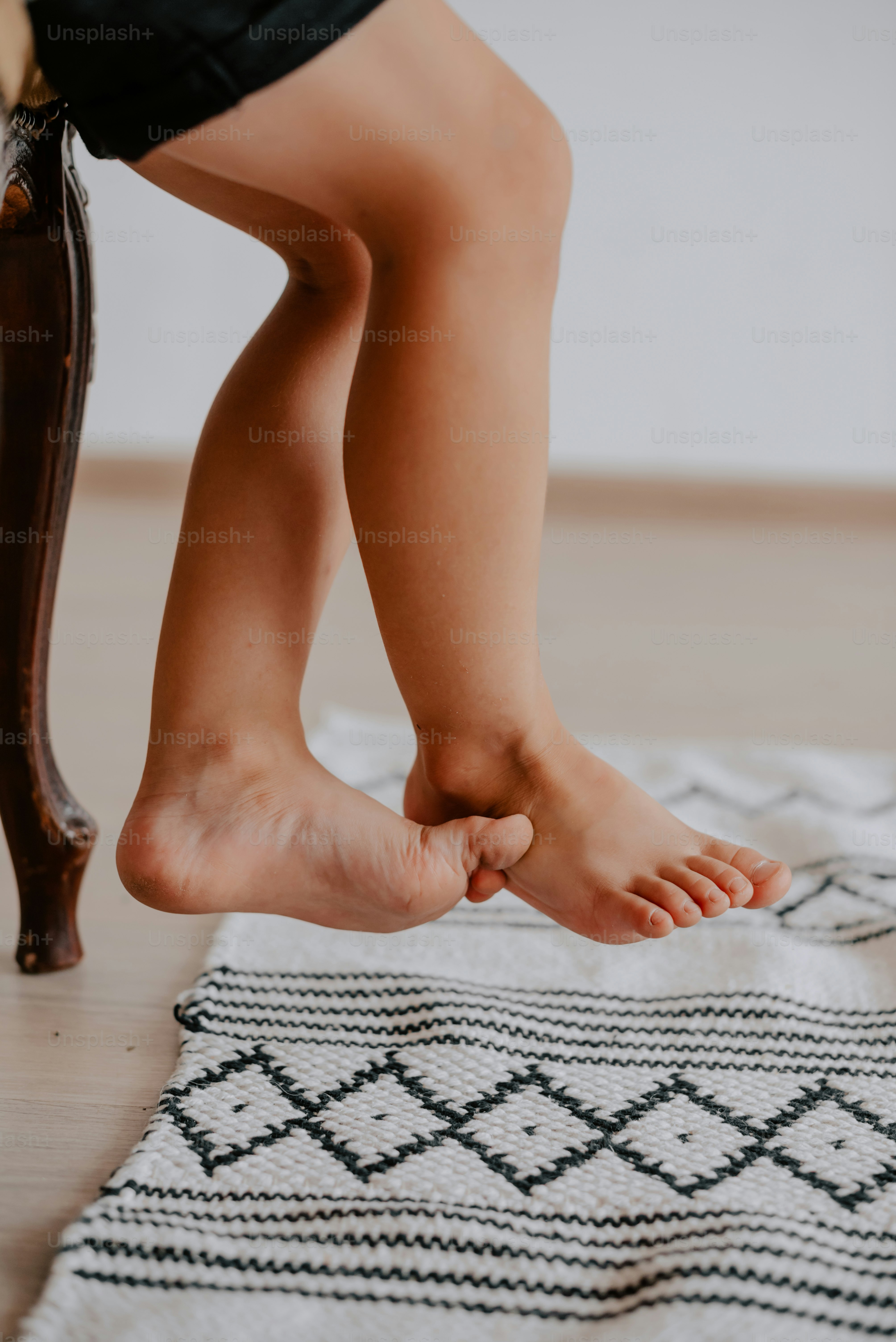 a person standing on top of a rug on the floor