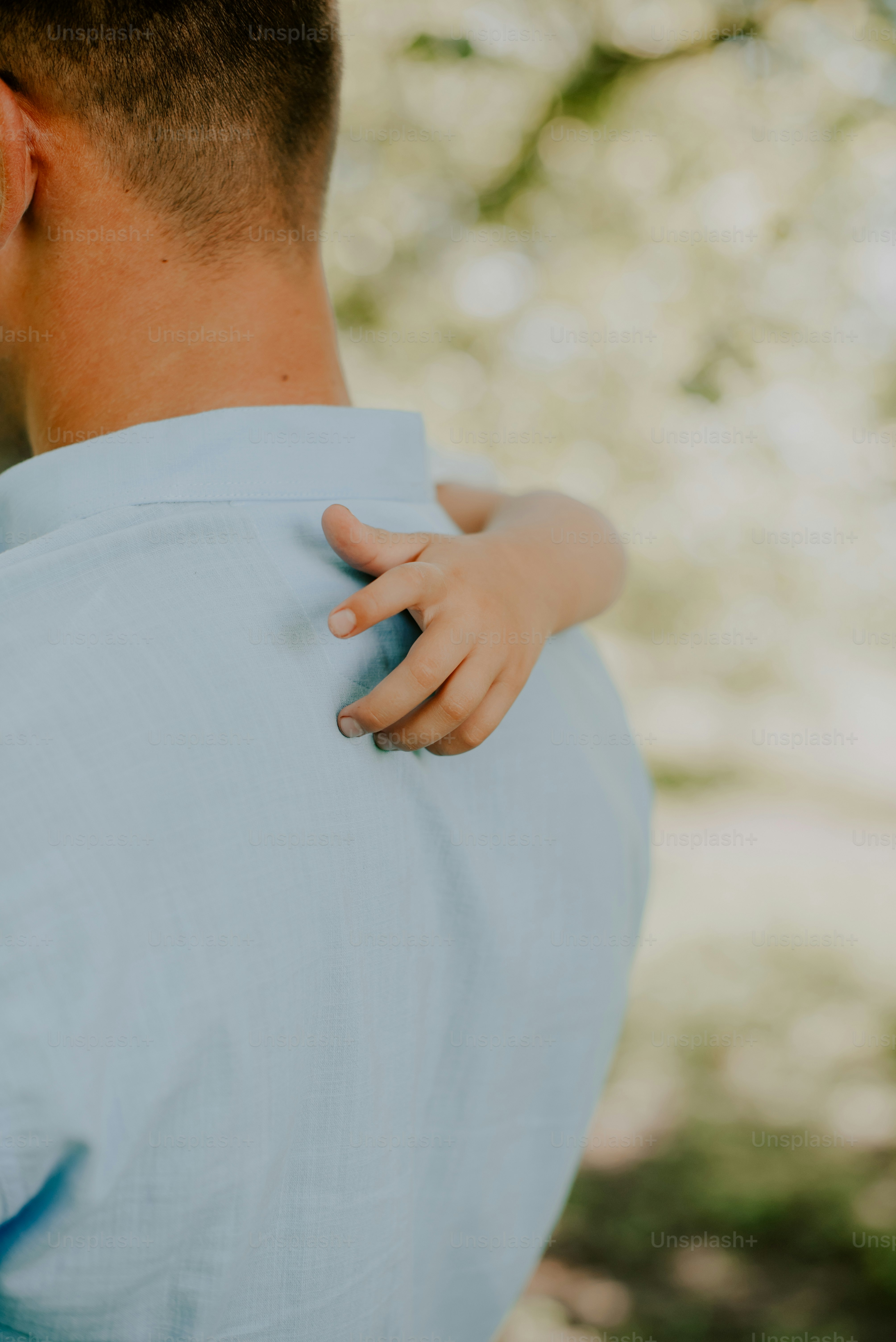 a close up of a person holding a child