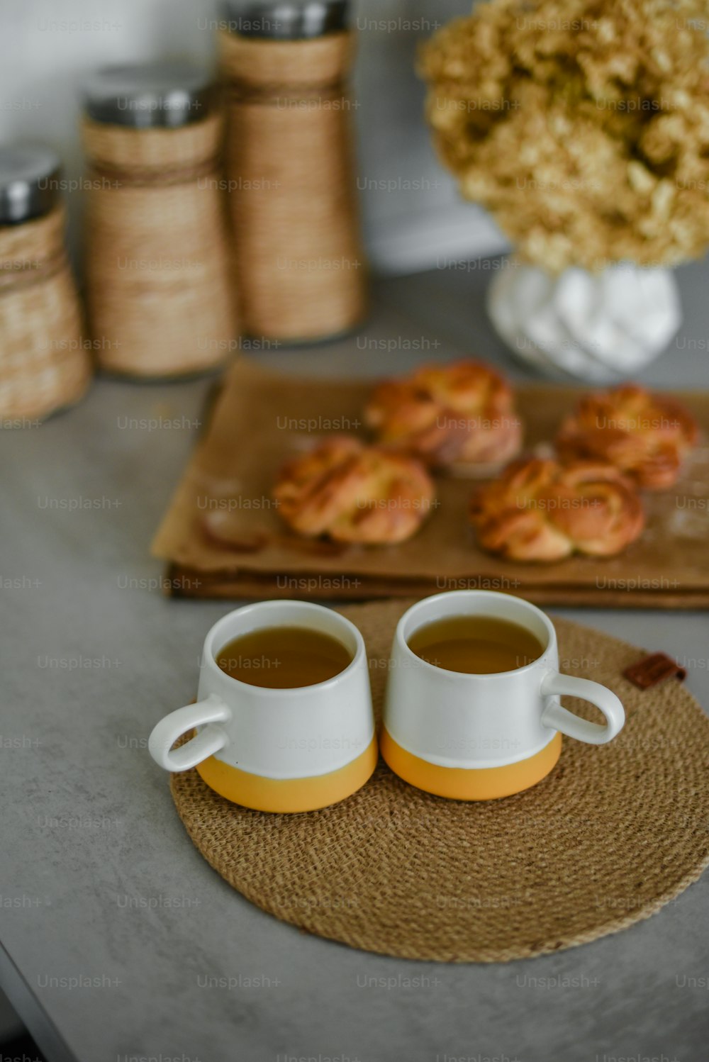 a couple of cups of coffee sitting on top of a table