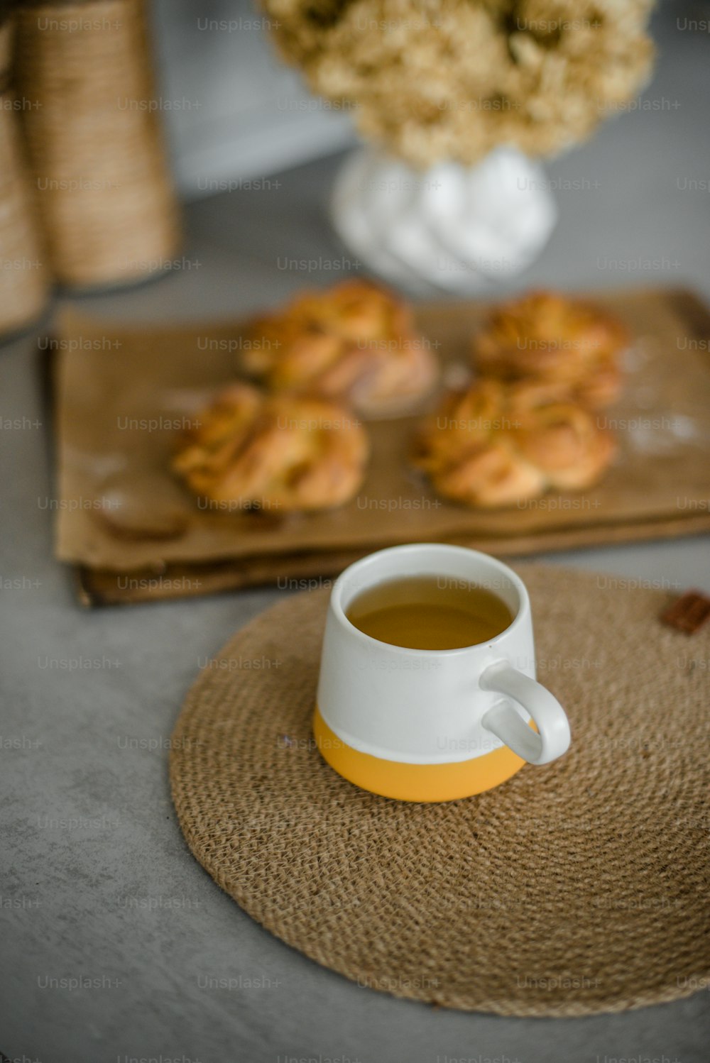 a cup of tea and some cookies on a table