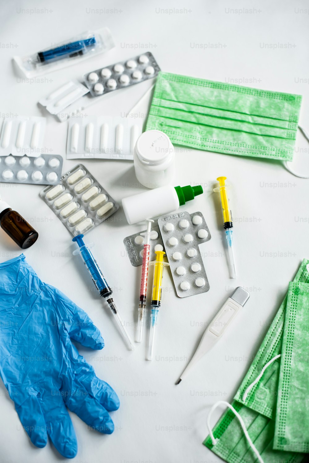 a white table topped with medical supplies and gloves