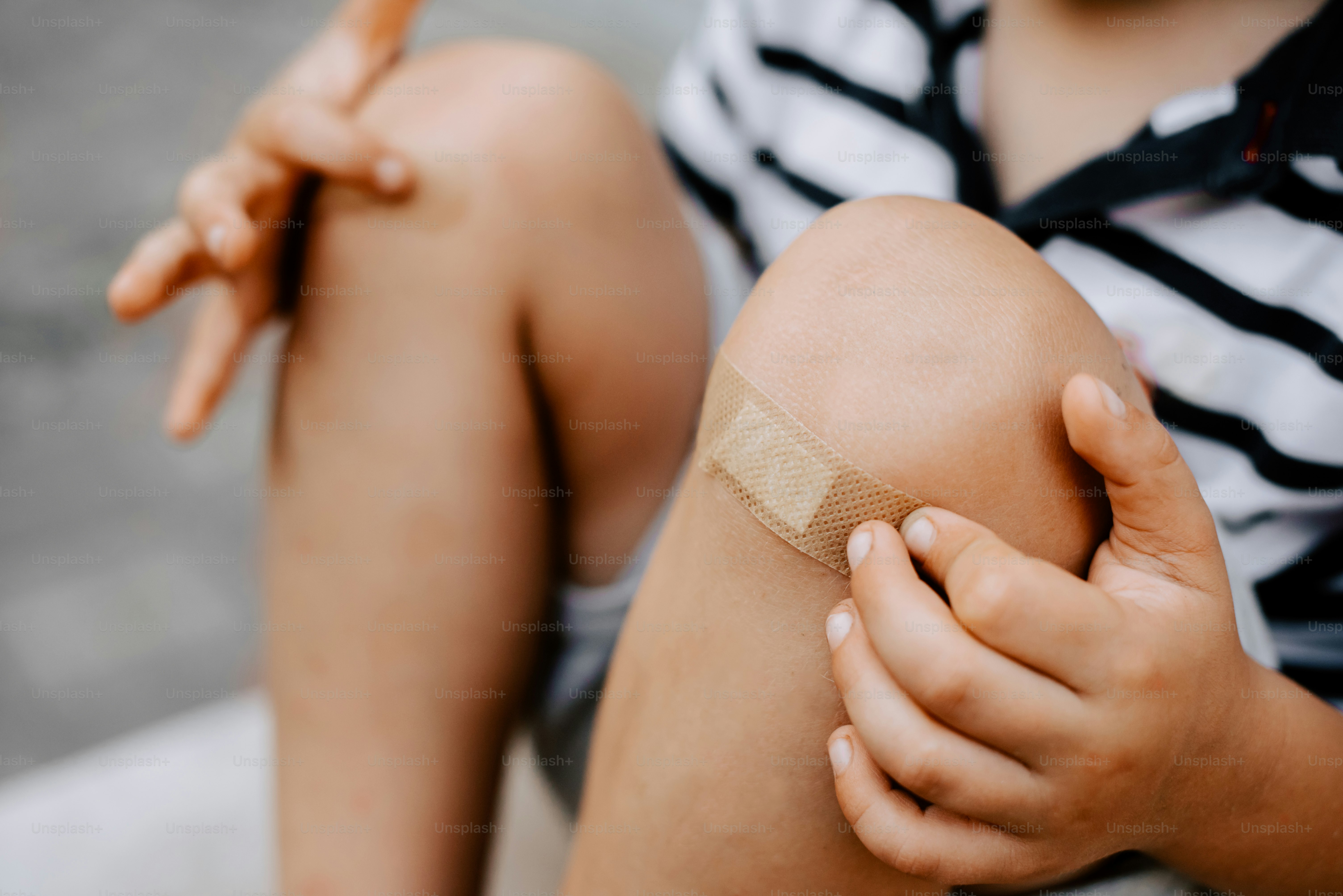 a person with a bandage on their knee