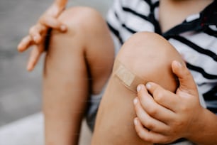 a person with a bandage on their knee