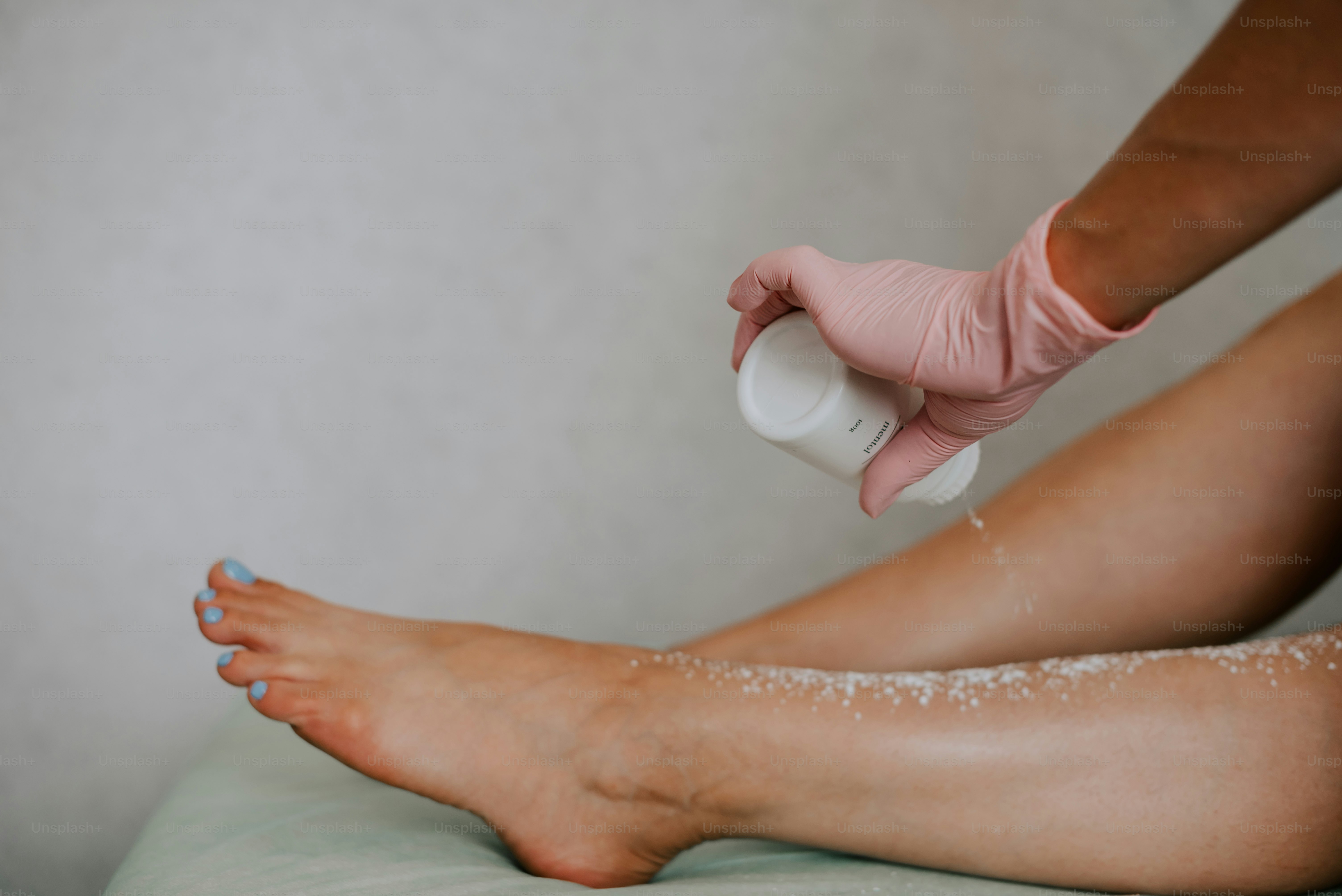 a person is getting a manicure on their foot